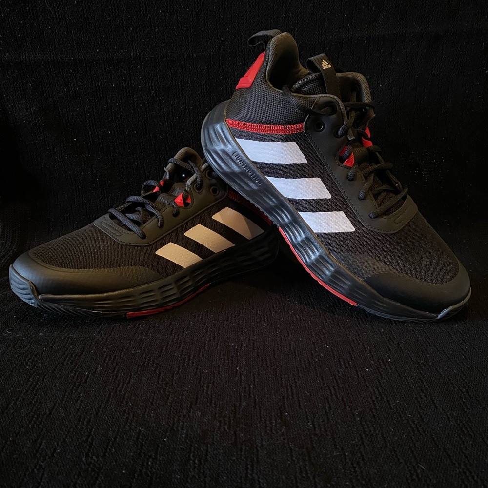 Size 10 Adidas “Own The Game” basketball shoes.